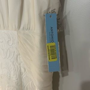 White brocade like dress with sheer tie belt Antonio Melani